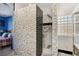 Modern bathroom with marble and dark tile shower at 1150 Calcione Dr, Henderson, NV 89011