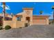 House exterior with double car garage and landscaping at 1150 Calcione Dr, Henderson, NV 89011