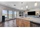 Island kitchen with stainless steel appliances and view to patio at 1150 Calcione Dr, Henderson, NV 89011