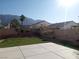 Spacious backyard with patio, artificial turf, and mountain views at 6449 Elizabethtown Ave, Las Vegas, NV 89110