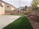 Artificial turf and stone retaining walls in backyard at 6449 Elizabethtown Ave, Las Vegas, NV 89110