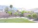 Landscaped backyard with artificial turf and mountain views at 6449 Elizabethtown Ave, Las Vegas, NV 89110