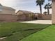 Large backyard with artificial turf and a patio area at 6449 Elizabethtown Ave, Las Vegas, NV 89110