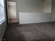 Carpeted bedroom with large window and access to bathroom at 6449 Elizabethtown Ave, Las Vegas, NV 89110