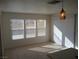 Bright dining area with tile floors and sliding glass doors at 6449 Elizabethtown Ave, Las Vegas, NV 89110