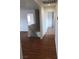 Upstairs hallway with hardwood floors and access to bedrooms at 6449 Elizabethtown Ave, Las Vegas, NV 89110