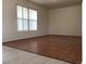 Living room with hardwood floors and window at 6449 Elizabethtown Ave, Las Vegas, NV 89110