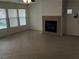 Living room with tile floors, fireplace and large windows at 6449 Elizabethtown Ave, Las Vegas, NV 89110