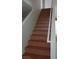 Wood staircase leading to the upper level of the home at 6449 Elizabethtown Ave, Las Vegas, NV 89110