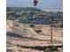 Landscape view featuring homes, desert landscaping, and hot air balloons overhead at 977 Majestic Vw, Mesquite, NV 89034