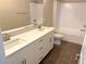 Bathroom with double vanity, white cabinets and a bathtub at 9886 Belikove Manor Ave, Las Vegas, NV 89178