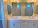 Double vanity bathroom with quartz countertop and large mirrors at 9886 Belikove Manor Ave, Las Vegas, NV 89178