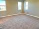 Spacious bedroom with neutral walls and carpeted flooring at 9886 Belikove Manor Ave, Las Vegas, NV 89178