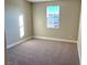 Bright bedroom with carpet flooring and large window at 9886 Belikove Manor Ave, Las Vegas, NV 89178