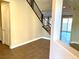 Bright entryway with tile flooring and modern staircase at 9886 Belikove Manor Ave, Las Vegas, NV 89178