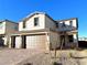 Two-story house with brown double-door garage and brick driveway at 9886 Belikove Manor Ave, Las Vegas, NV 89178