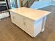 Large kitchen island with white cabinets and quartz countertop at 9886 Belikove Manor Ave, Las Vegas, NV 89178