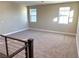 Spacious loft area with carpet and multiple windows at 9886 Belikove Manor Ave, Las Vegas, NV 89178