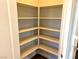 Corner pantry with ample shelving for storage at 9886 Belikove Manor Ave, Las Vegas, NV 89178