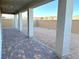 Covered patio with brick pavers and view of backyard at 9886 Belikove Manor Ave, Las Vegas, NV 89178