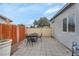 Comfortable backyard patio area featuring a dining table, chairs, and privacy screen at 1334 Eastwood Dr, Las Vegas, NV 89104