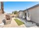 Outdoor space with patio, grill, and hanging chairs at 1334 Eastwood Dr, Las Vegas, NV 89104