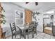 Cozy dining area with a gray table and chairs, decorative brick, and views from a window at 1334 Eastwood Dr, Las Vegas, NV 89104