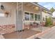 Inviting front porch with seating and decorative hanging plants for curb appeal at 1334 Eastwood Dr, Las Vegas, NV 89104