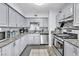 Bright kitchen featuring granite countertops, stainless steel appliances, and plentiful cabinetry at 1334 Eastwood Dr, Las Vegas, NV 89104