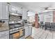 Updated kitchen with stainless appliances and an open layout leading into the living area at 1334 Eastwood Dr, Las Vegas, NV 89104