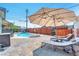 Inviting backyard oasis featuring a sparkling pool and patio at 1334 Eastwood Dr, Las Vegas, NV 89104