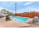 Relaxing swimming pool area with comfortable seating and privacy fencing at 1334 Eastwood Dr, Las Vegas, NV 89104