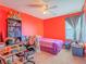 Vibrant bedroom with a double bed, desk and storage at 4590 Lime Straight Dr, Las Vegas, NV 89115