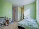 Bright bedroom with a double bed, desk, and window coverings at 4590 Lime Straight Dr, Las Vegas, NV 89115