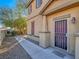 House exterior with walkway and purple security door at 4590 Lime Straight Dr, Las Vegas, NV 89115