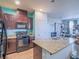 Modern kitchen with granite countertops and stainless steel appliances at 4590 Lime Straight Dr, Las Vegas, NV 89115