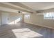 Spacious living room with bright windows and a ceiling fan, features hard surface floors at 4485 S Nellis Blvd, Las Vegas, NV 89121