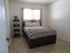 Bedroom with plush bedding and built-in shelving at 5900 Gordon Ave, Las Vegas, NV 89108