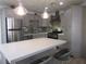 Modern kitchen with island, stainless steel appliances, and gray cabinets at 5900 Gordon Ave, Las Vegas, NV 89108