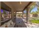 Covered patio with outdoor seating area and spiral staircase leading to rooftop at 17 Winding Rd, Henderson, NV 89052