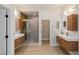 Dual sink bathroom offers a walk-in shower and bright lighting at 17 Winding Rd, Henderson, NV 89052
