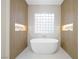 Contemporary bathroom featuring a luxurious soaking tub and modern design at 17 Winding Rd, Henderson, NV 89052