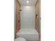 Beautiful bathroom featuring a shower-tub combo with hexagon tiling and wood accents at 17 Winding Rd, Henderson, NV 89052