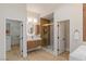 Light and bright bathroom features a soaking tub, a walk-in shower, and double sinks at 17 Winding Rd, Henderson, NV 89052