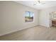 Spacious bedroom featuring wood floors, a ceiling fan and lots of natural light at 17 Winding Rd, Henderson, NV 89052