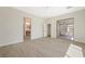 Large bedroom featuring hardwood floors, access to patio, and access to en-suite bathroom at 17 Winding Rd, Henderson, NV 89052