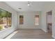 Bright, spacious bedroom with ample natural light, wood-style flooring, and neutral wall color at 17 Winding Rd, Henderson, NV 89052