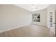 Bright bedroom featuring hardwood floors, a modern ceiling fan, and a large window offering natural light at 17 Winding Rd, Henderson, NV 89052