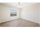 Neutral bedroom with a large window offering views of the surrounding mountains at 17 Winding Rd, Henderson, NV 89052