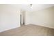 Bright bedroom with hardwood floors and a walk-in closet for ample storage space at 17 Winding Rd, Henderson, NV 89052